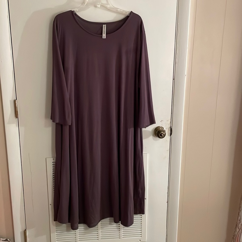 Charcoal gray, super soft t-shirt dress with 3/4 sleeves and pockets.